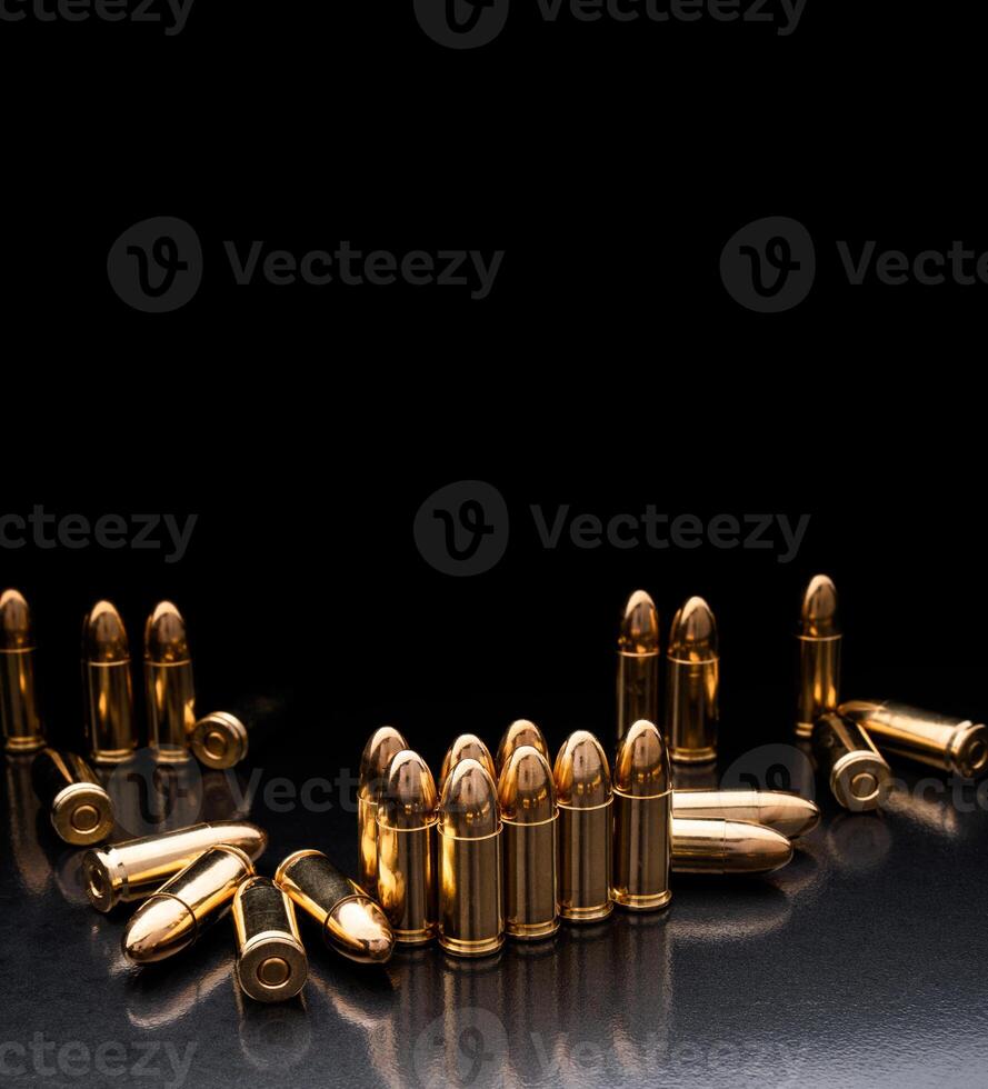 Bullet isolated on black background with reflexion. Rifle bullets close-up on black back. Cartridges for rifle and carbine on a black. photo