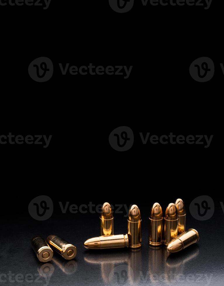 Bullet isolated on black background with reflexion. Rifle bullets close-up on black back. Cartridges for rifle and carbine on a black. photo