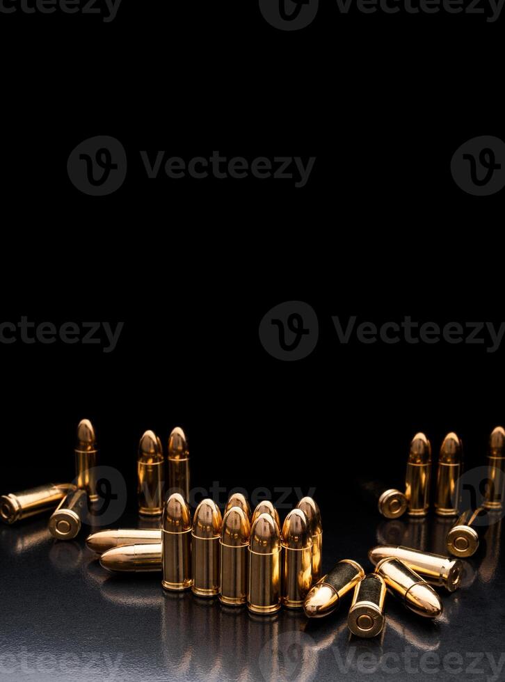 Bullet isolated on black background with reflexion. Rifle bullets close-up on black back. Cartridges for rifle and carbine on a black. photo