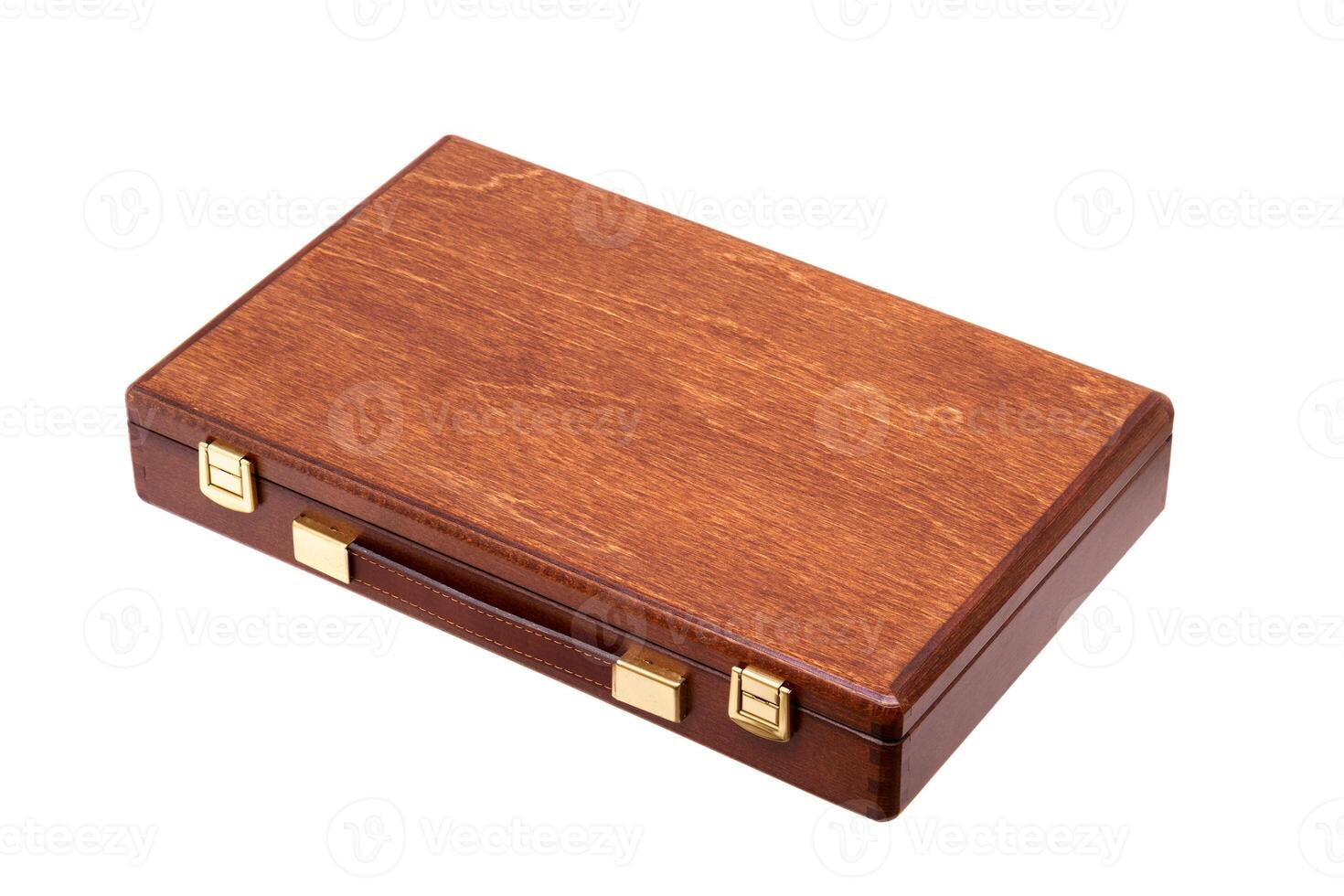 wooden brown box with a handle and gold locks isolated on white photo