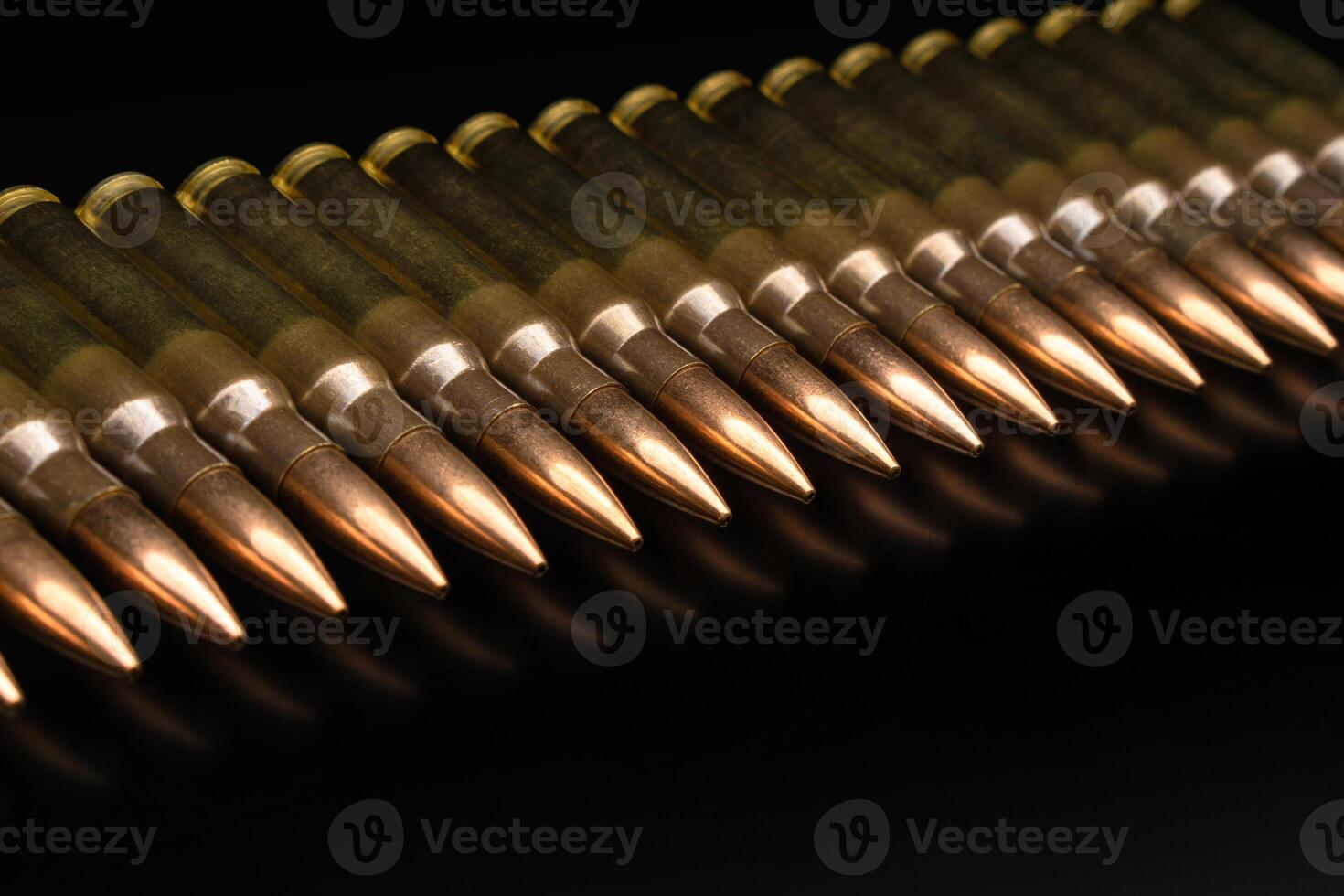 Bullet isolated on black background with reflexion. Rifle bullets close-up on black back. Cartridges for rifle and carbine on a black. photo