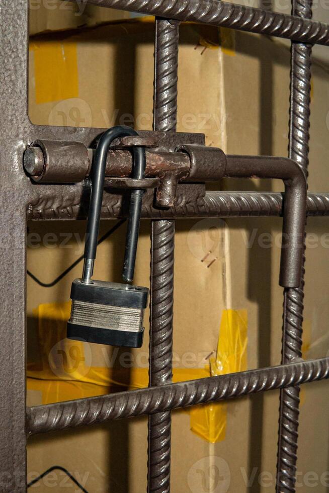 open padlock on the cage photo
