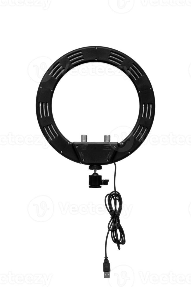 Closeup of circular neon LED lamp isolated white background. Popular modern light for make-up and beauty portraits. photo