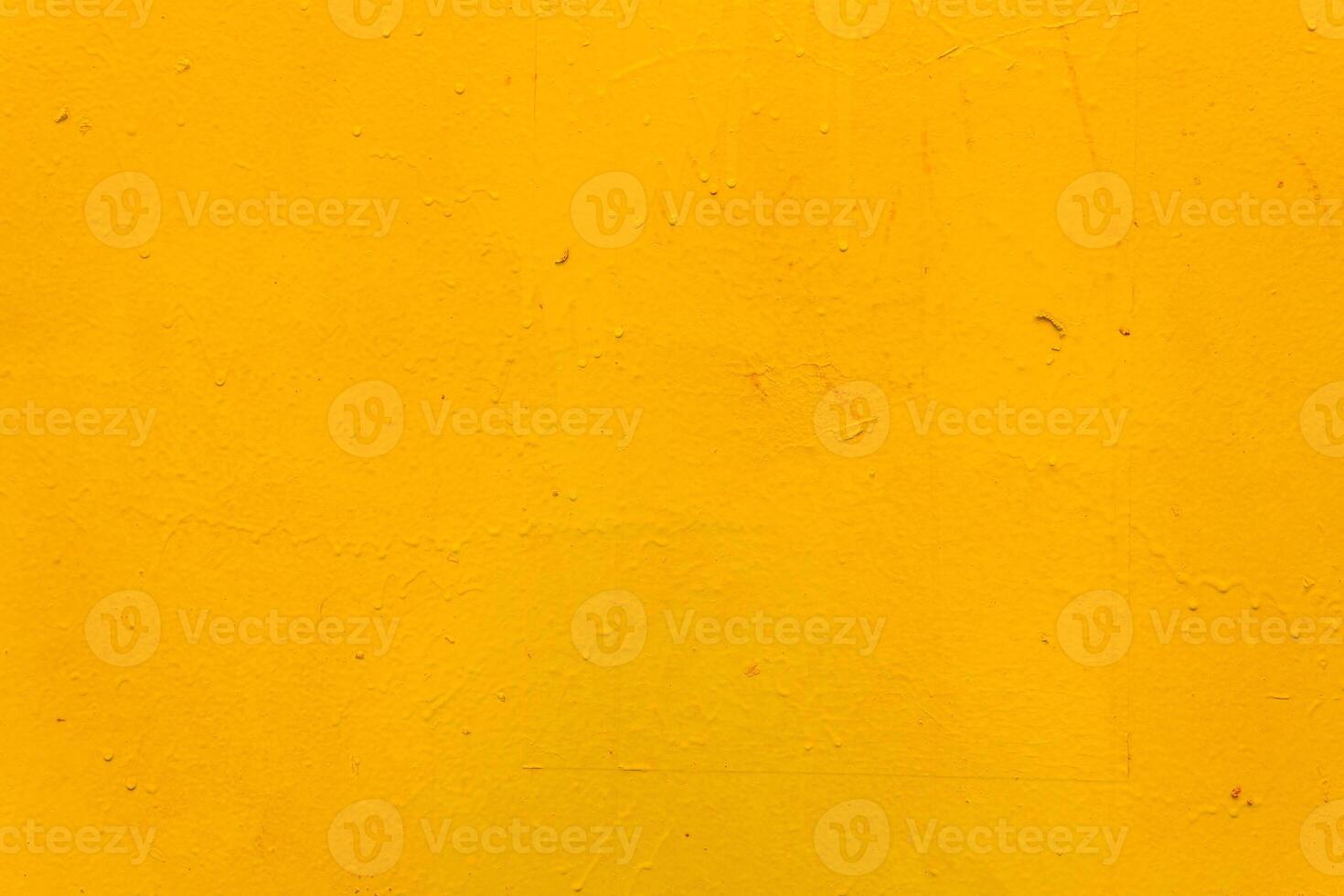 The metal surface is rough, with smudges, painted with yellow paint. Bright colored back. photo