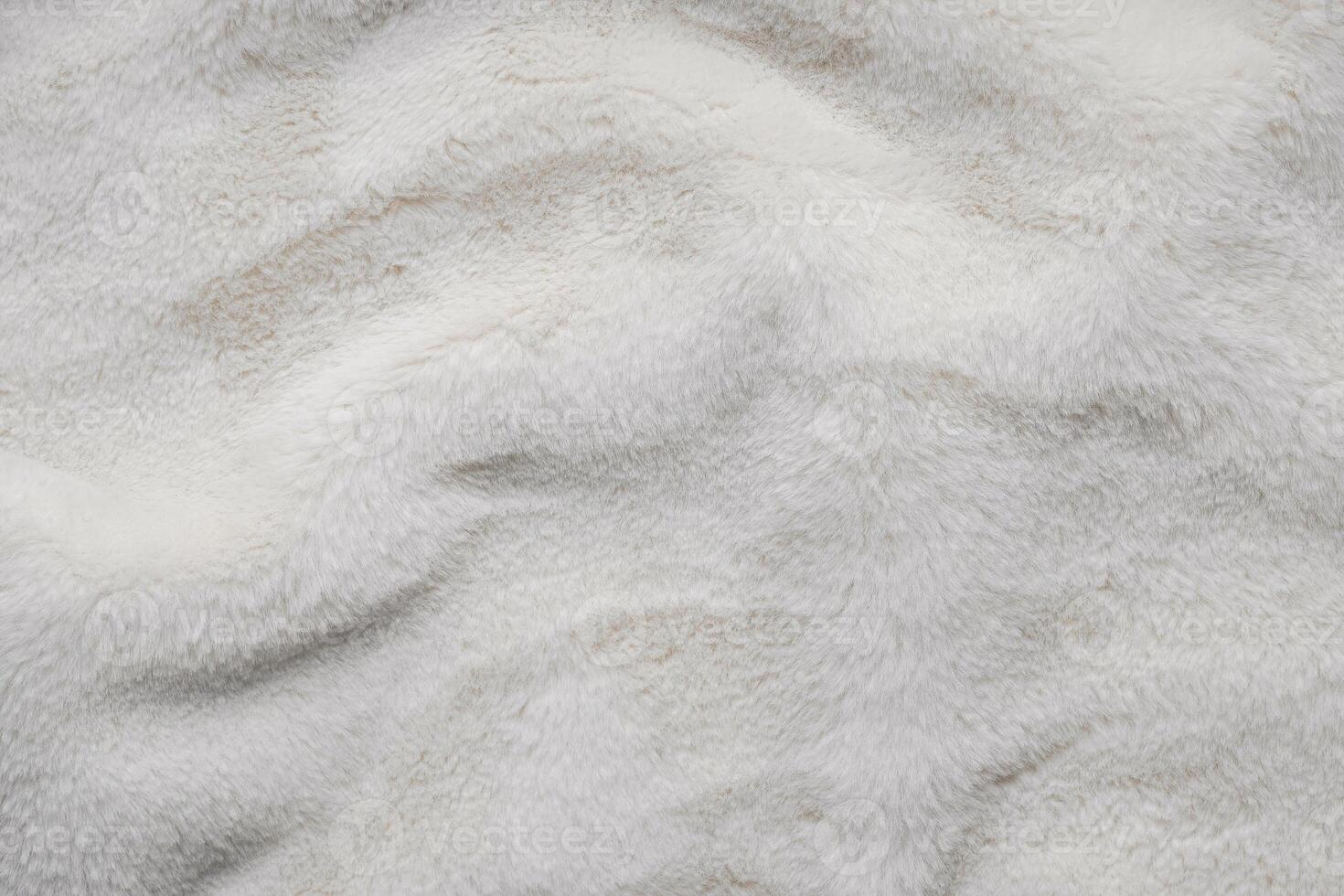 Texture of faux fur. Empty place for text, quote or sayings. Top view. Closeup. Light fur back. photo