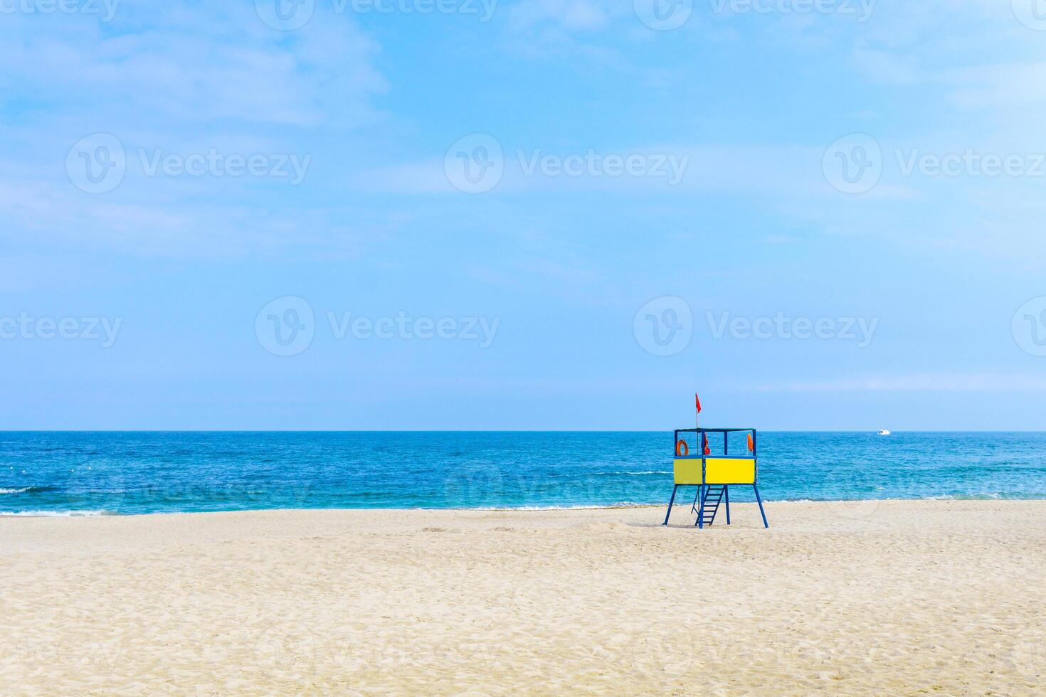 lifeguard tower at the beach. background for summer postcard from vacation photo