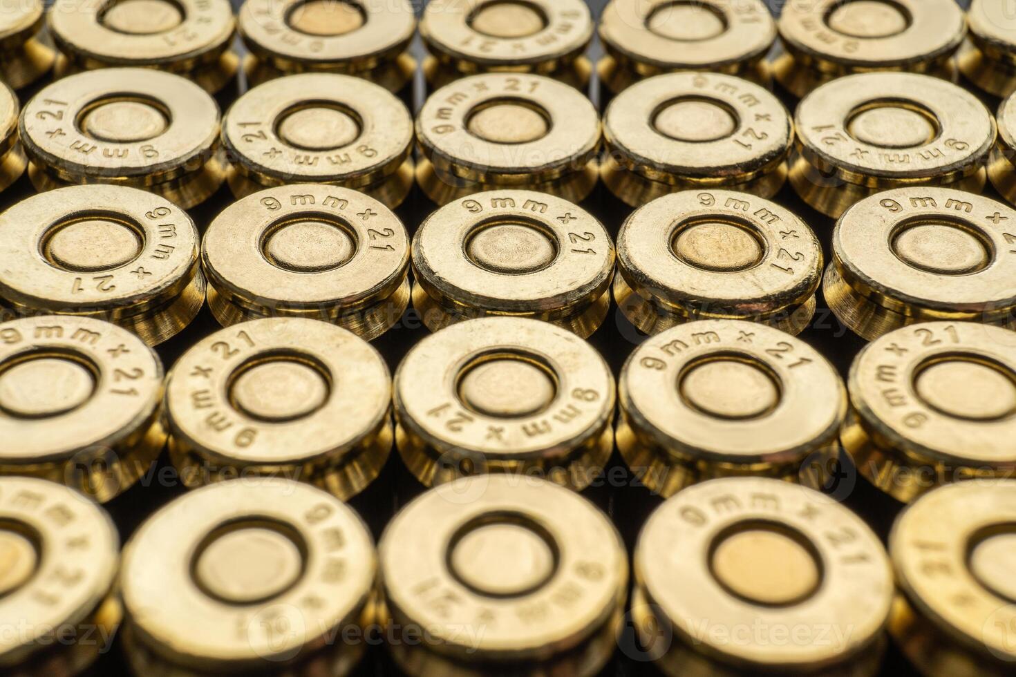 Close-up of a group of 9mm rounds. Cartridge background. New cartridges stacked neatly near each other. photo