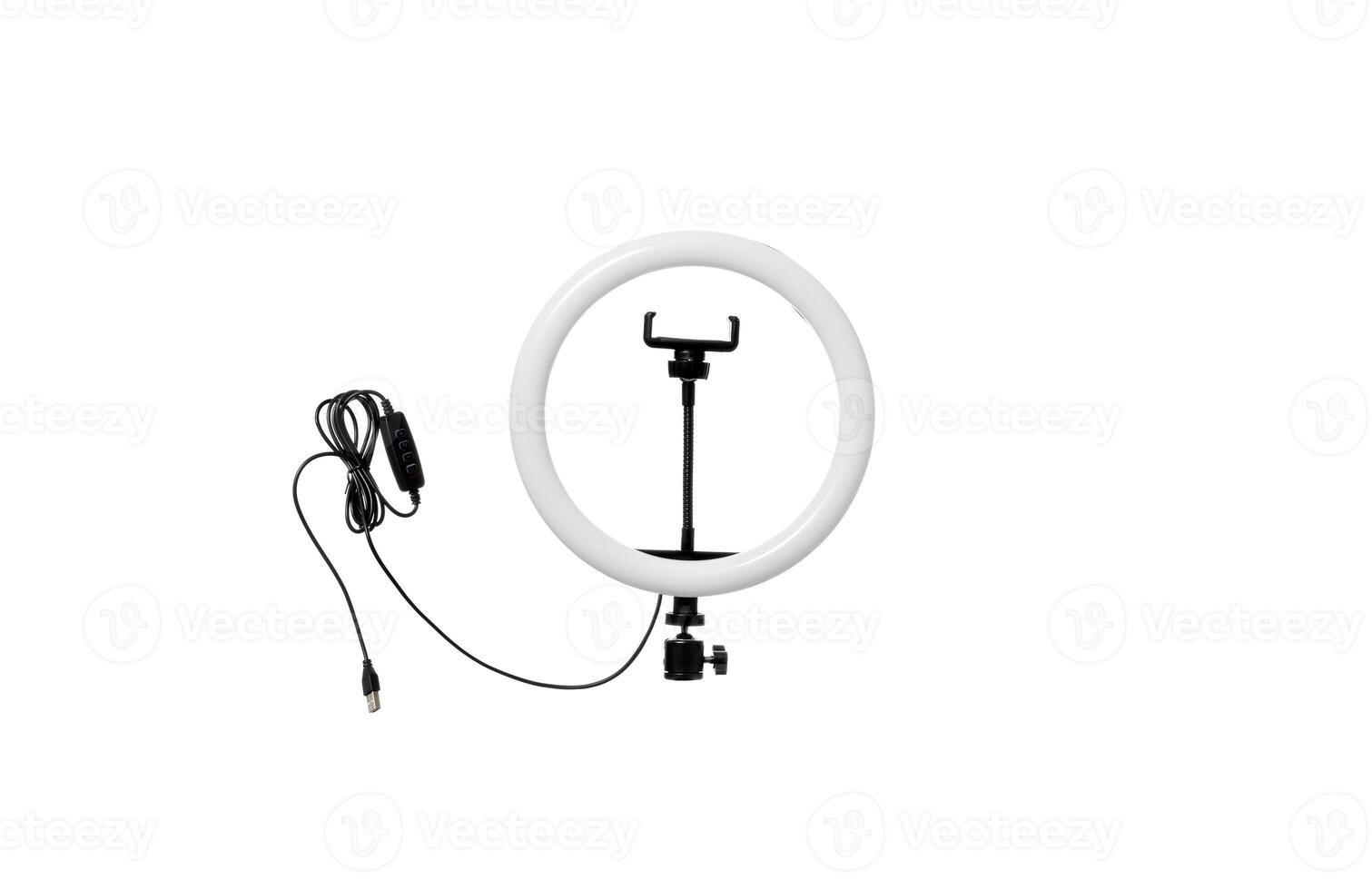 Closeup of circular neon LED lamp isolated white background. Popular modern light for make-up and beauty portraits. photo