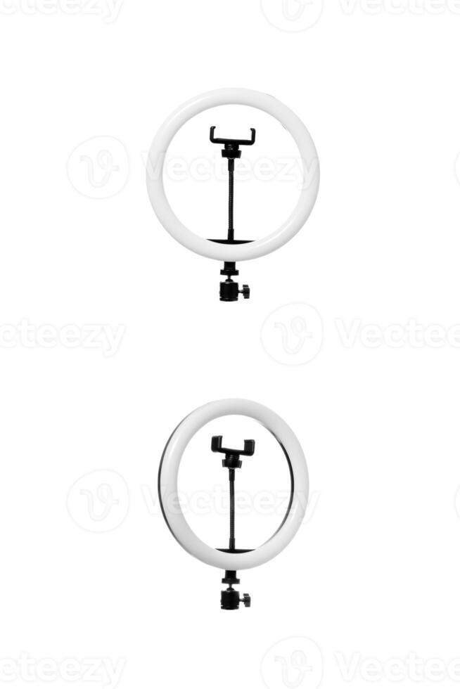 Closeup of circular neon LED lamp isolated white background. Popular modern light for make-up and beauty portraits. photo