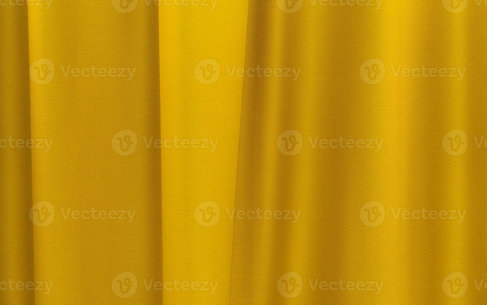 Fabric yellow curtains. Abstract background, curtain, drapes gold fabric. Crumpled cloth, folds of fabric. photo