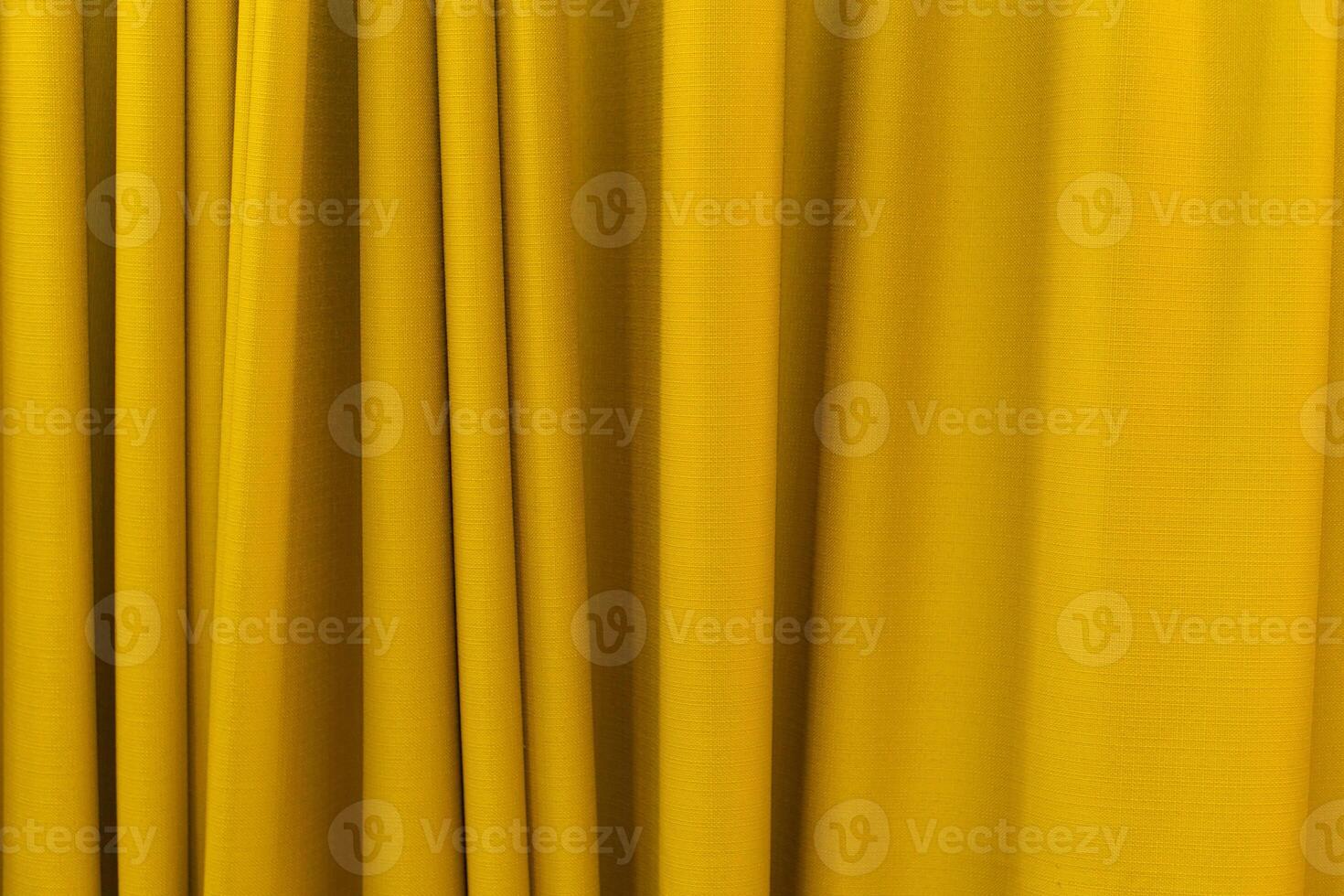 Fabric yellow curtains. Abstract background, curtain, drapes gold fabric. Crumpled cloth, folds of fabric. photo