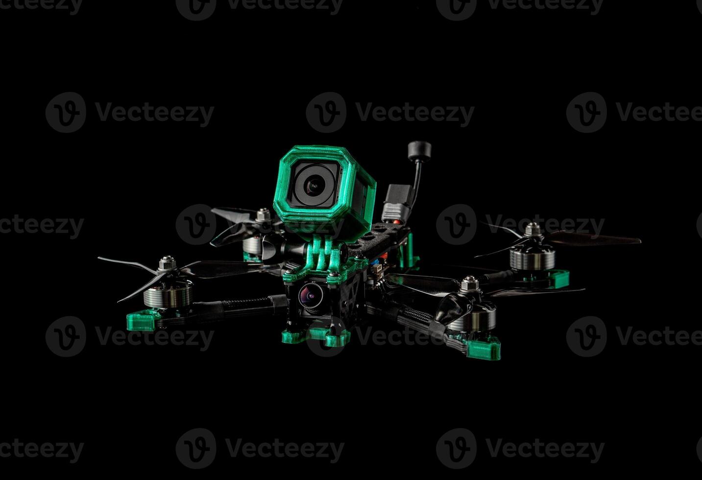 Modern FPV drone. Four-engine aircraft on the radio control. Drone for racing, filming and entertainment. Dark back. photo