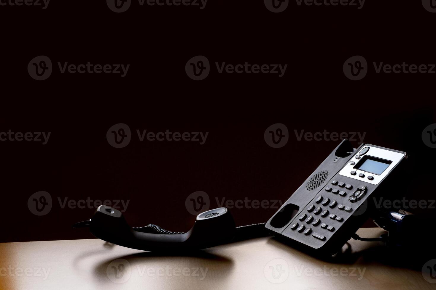 modern landline phone on the table photo