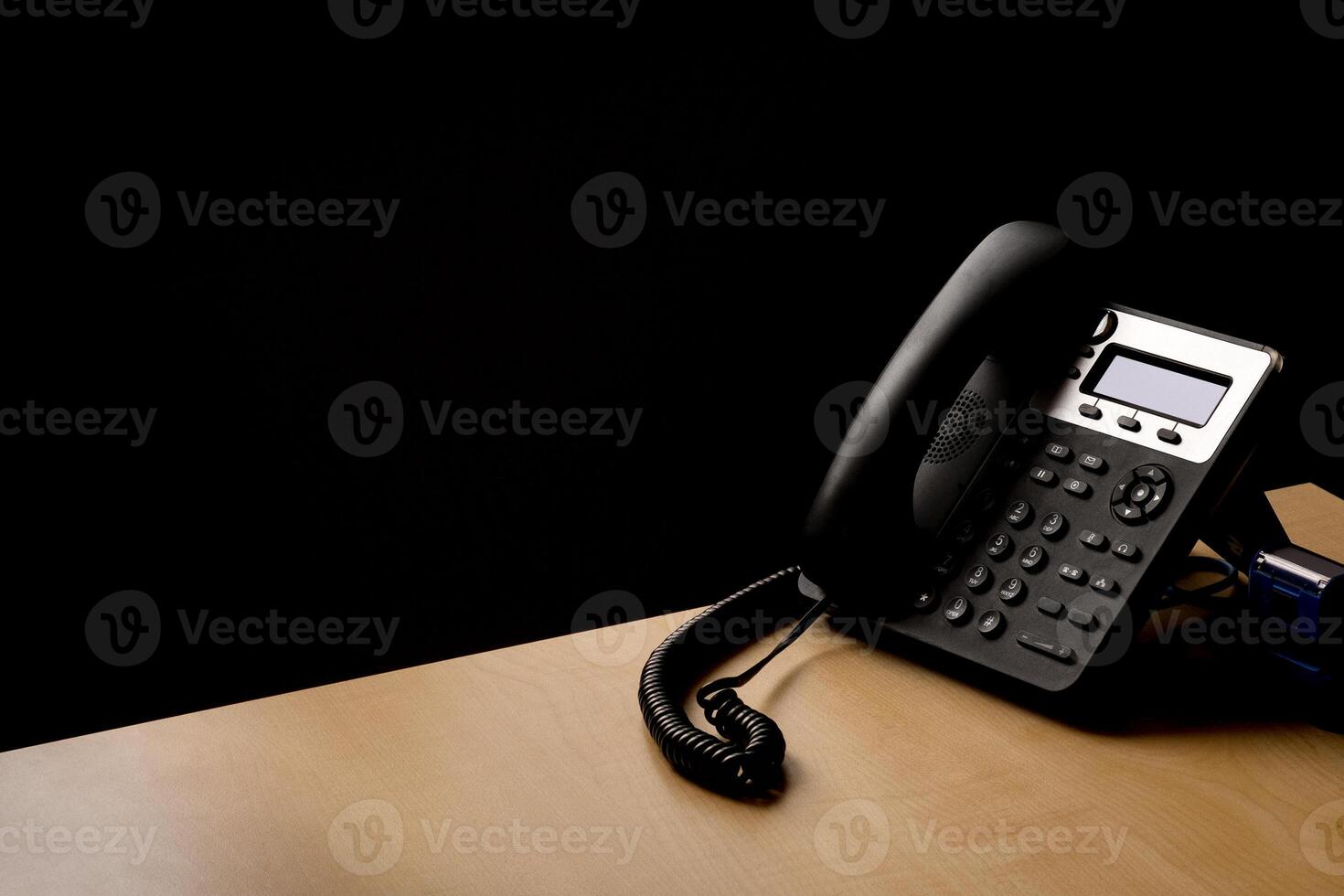 modern landline phone on the table photo