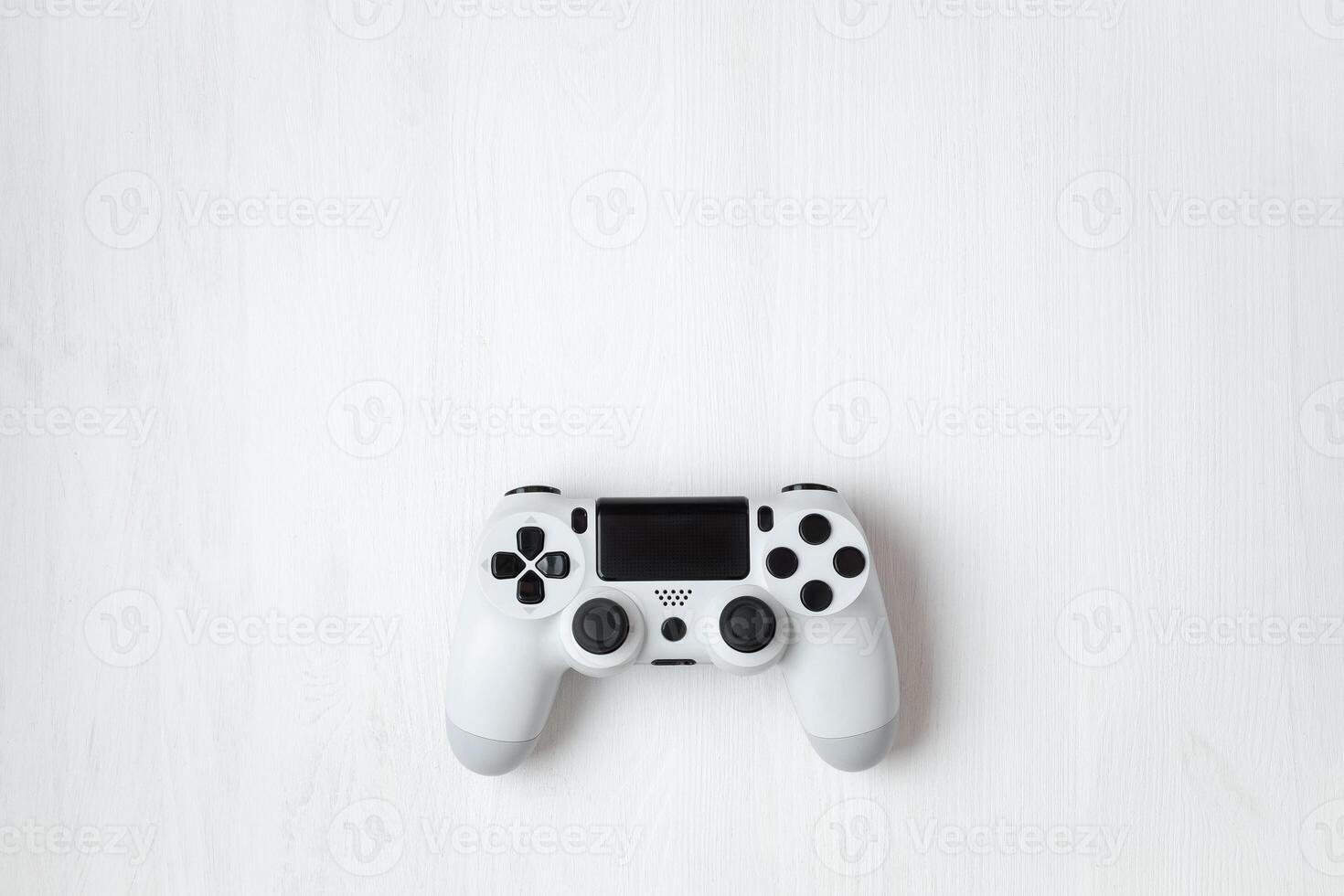 White modern gamepad on background photo