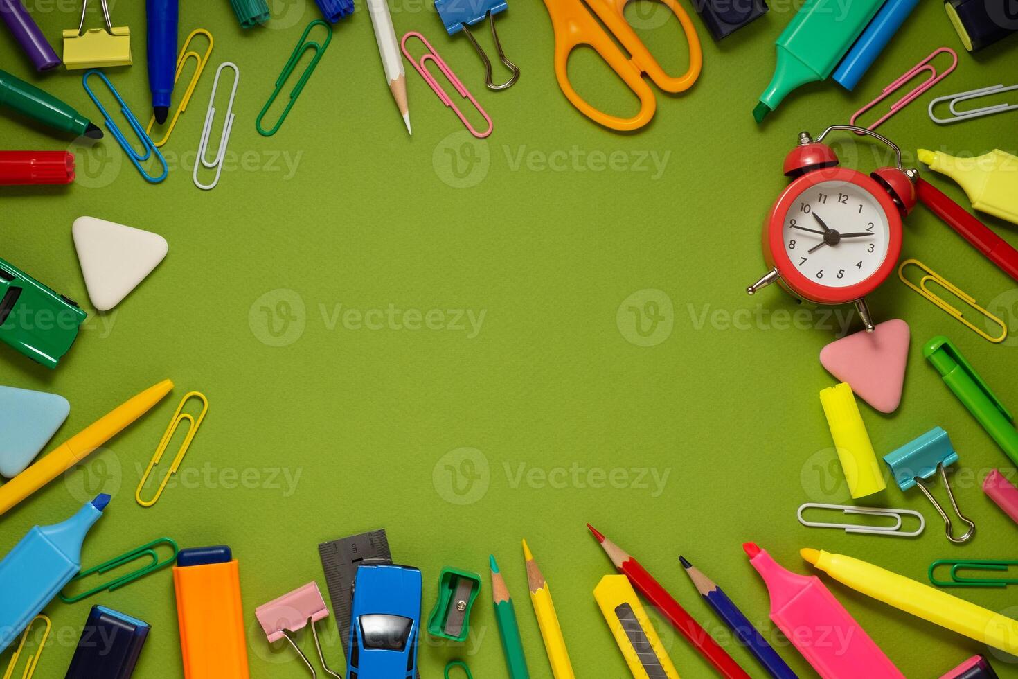 School office supplies on a desk with copy space. Back to school concept. School supplies on green background. Back 2 school concept photo