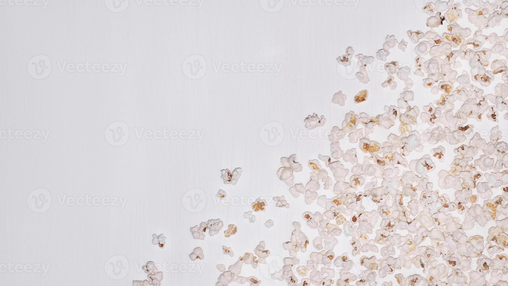 Popcorn on a white wooden background. photo