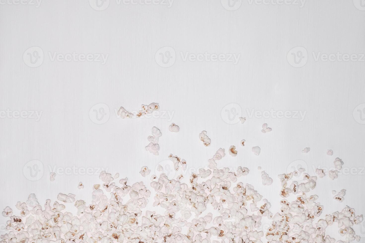 Popcorn on a white wooden background. photo
