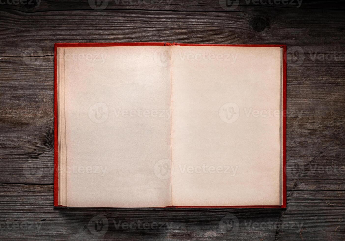 Vintage book, open, on old wooden table, with clipping path. Open Book blank on old wooden background. book with blank pages photo