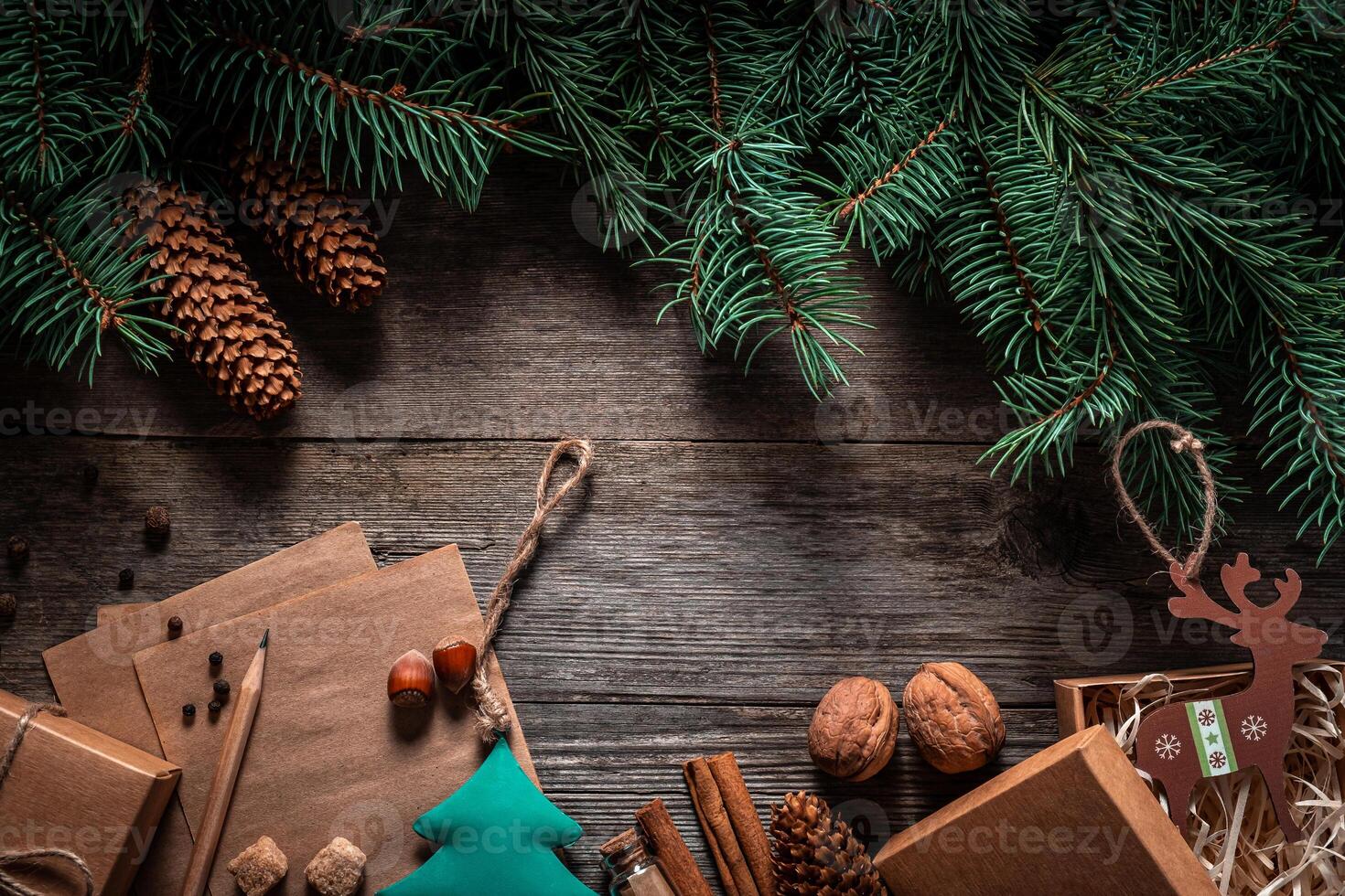 Christmas green frame from fir branches on a vintage gray board background. Frame of fir branches. Christmas card blank. photo