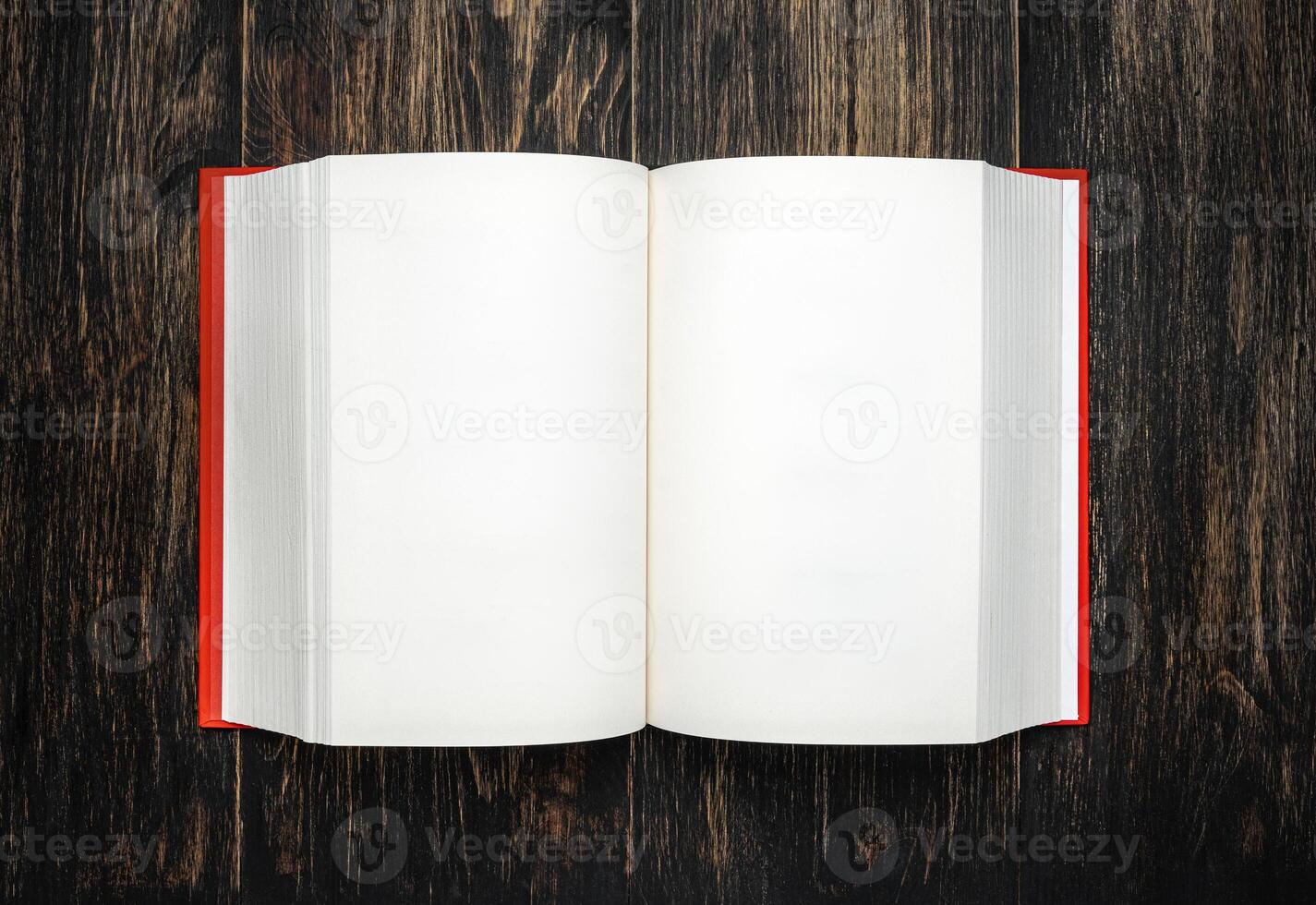 Book, open, on old wooden table, with clipping path. Open Book blank on old wooden background. book with blank pages photo