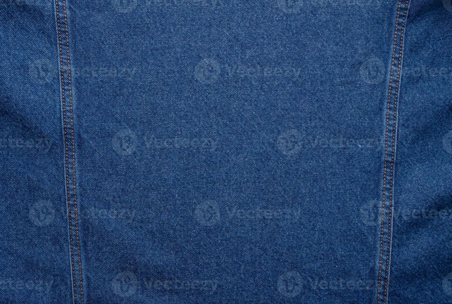 Blue denim texture. Closeup of denim jacket elements. Background for banner, poster or adrift. photo