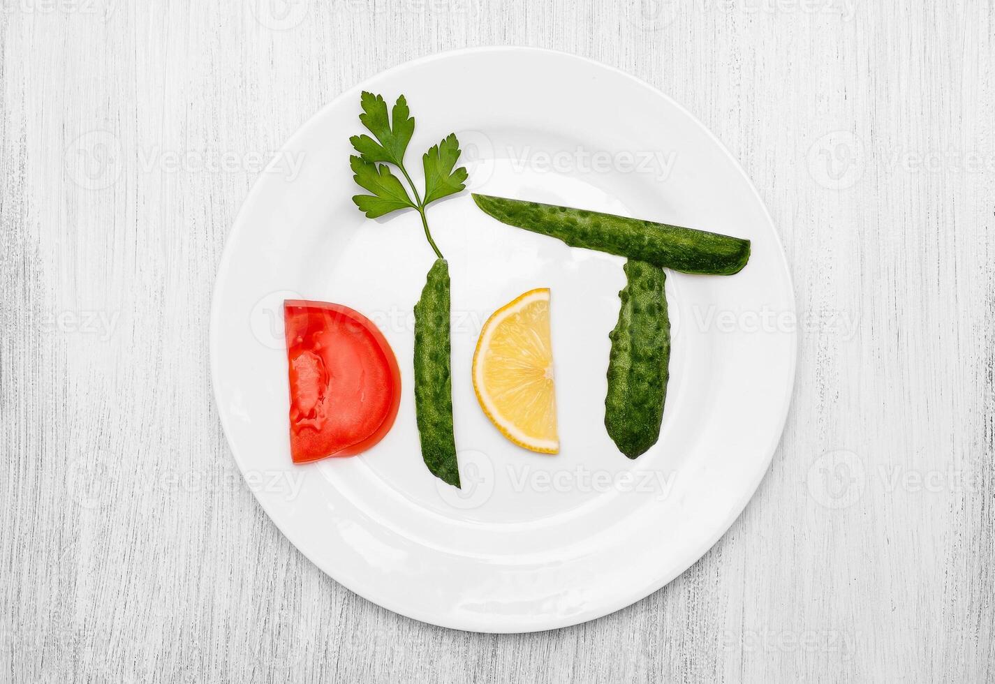 From vegetables word diet on a white plate photo