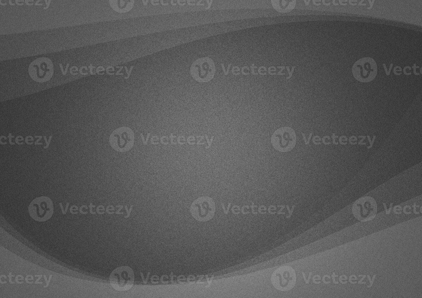 grainy gray background with a bright spot and light waves on the edges photo