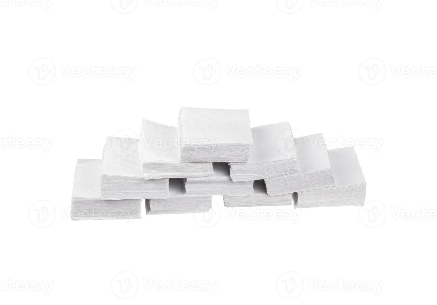 Patches for cleaning weapons isolate on a white back. White square scraps of fabric folded in a pile. photo