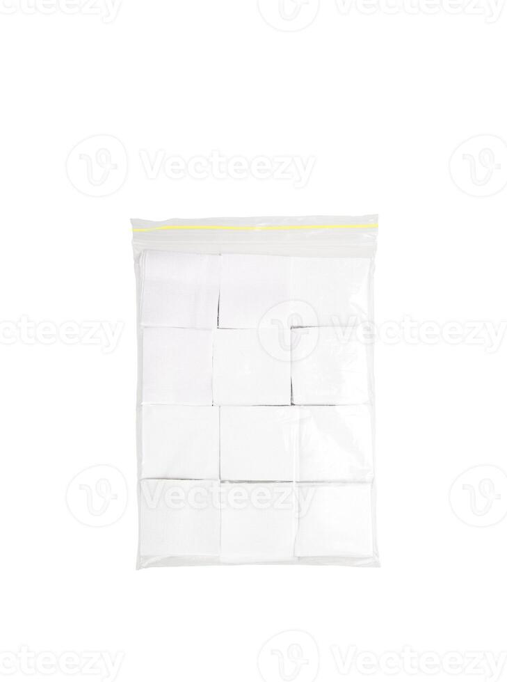 Patches for cleaning weapons isolate on a white background. White square scraps of fabric stacked in piles. photo