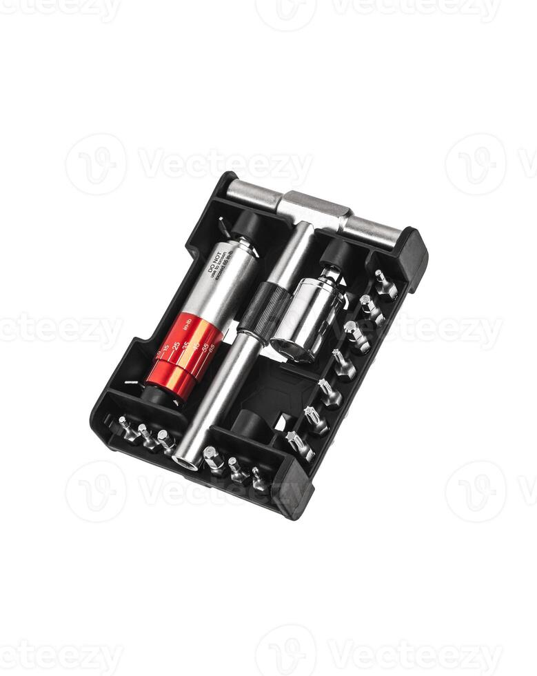 Screwdriver with reversible mechanism and magnetic holder of replaceable nozzles. A set of nozzles. Tools for construction and repair shop. Isolate on a white back. photo