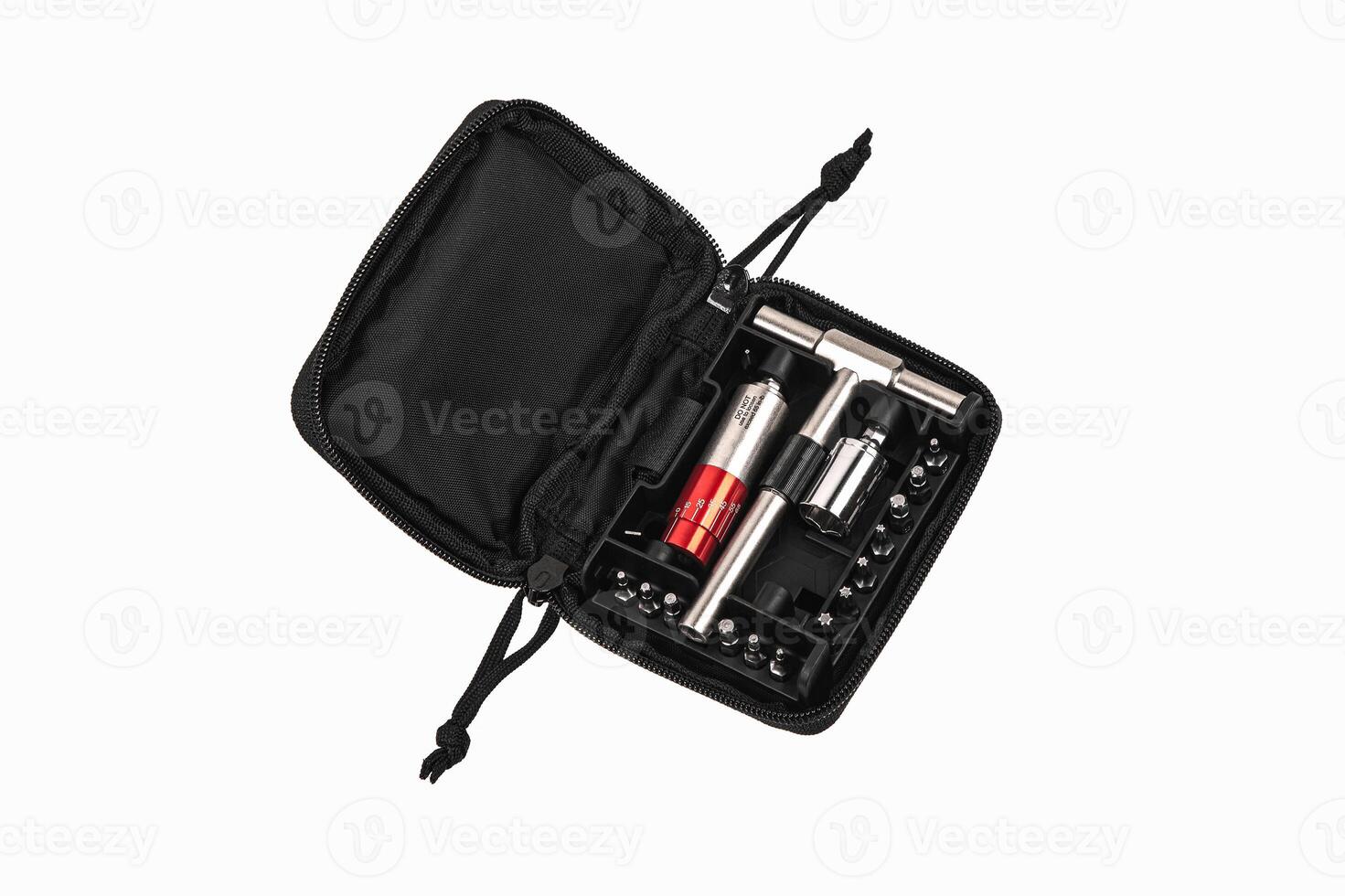 Screwdriver with reversible mechanism and magnetic holder of replaceable nozzles. A set of nozzles. Tools for construction and repair shop. Isolate on a white back. photo