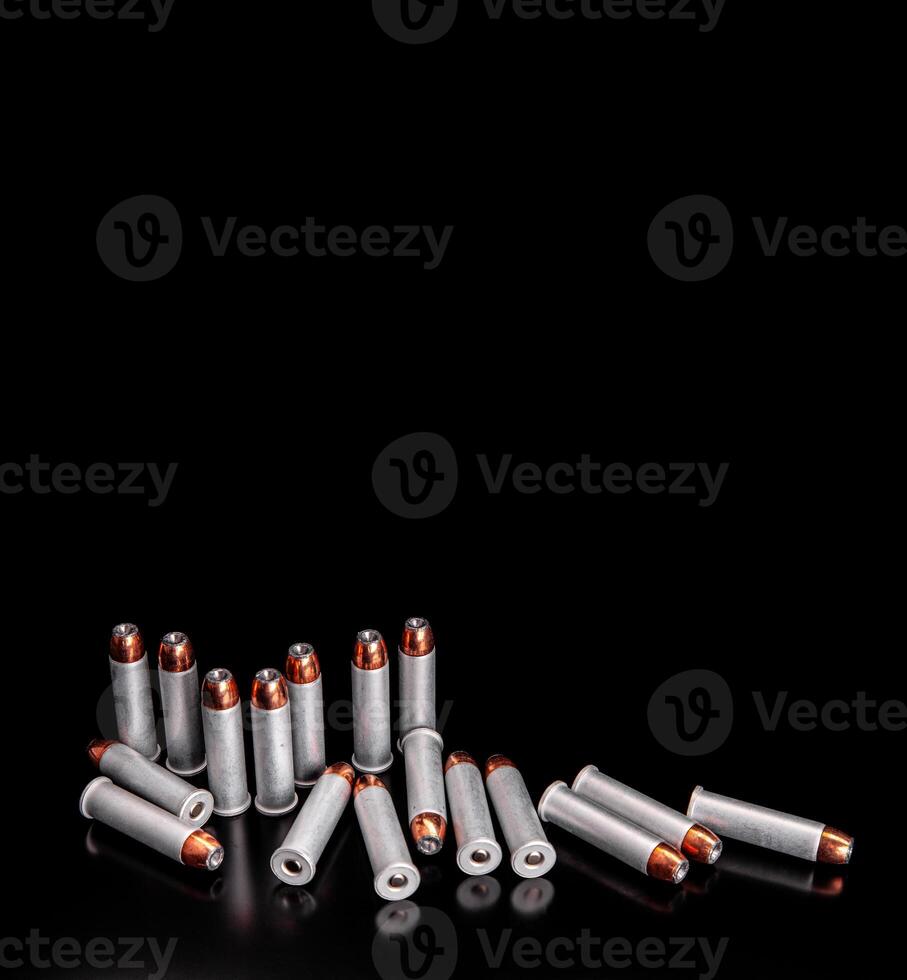 Bullet isolated on black background with reflexion. Rifle bullets close-up on black back. Cartridges for rifle and carbine on a black. photo