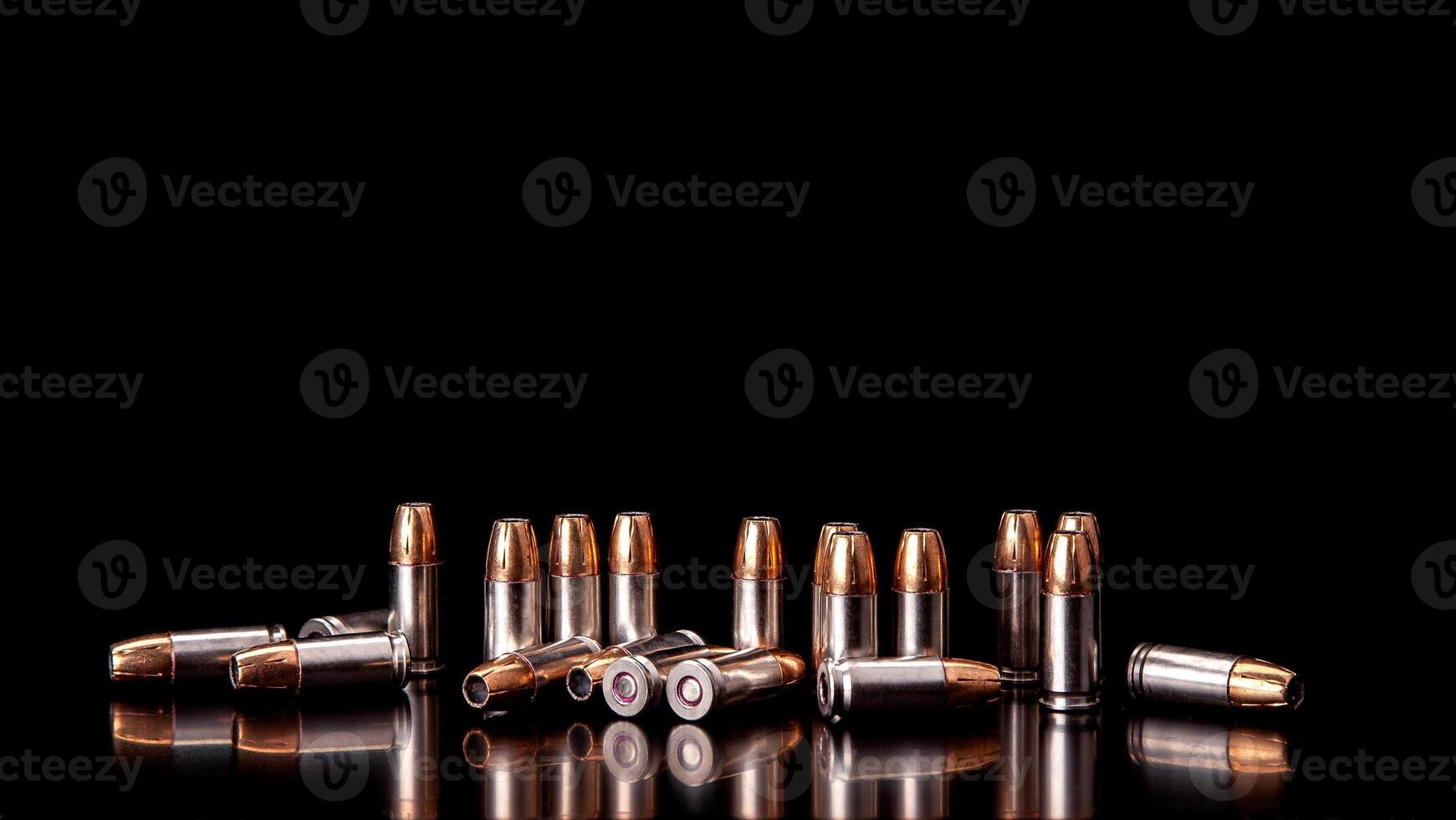 Bullet isolated on black background with reflexion. Rifle bullets close-up on black back. Cartridges for rifle and carbine on a black. photo
