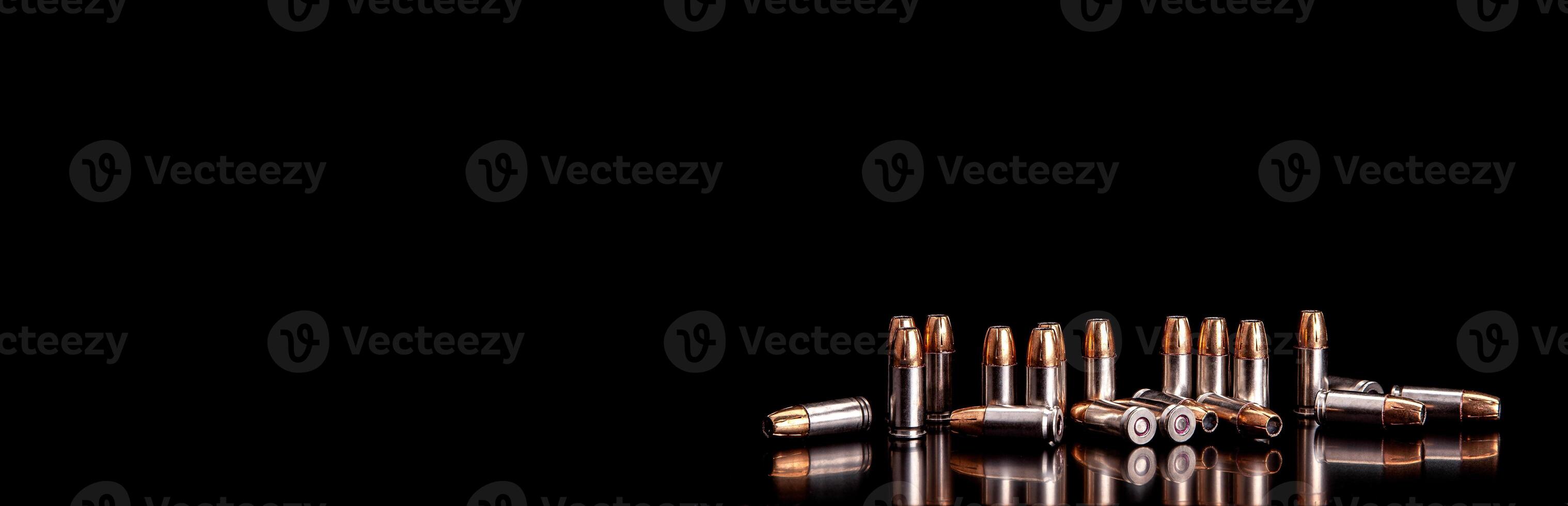 Bullet isolated on black background with reflexion. Rifle bullets close-up on black back. Cartridges for rifle and carbine on a black. photo