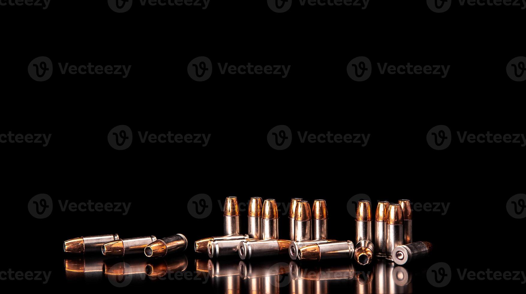 Bullet isolated on black background with reflexion. Rifle bullets close-up on black back. Cartridges for rifle and carbine on a black. photo