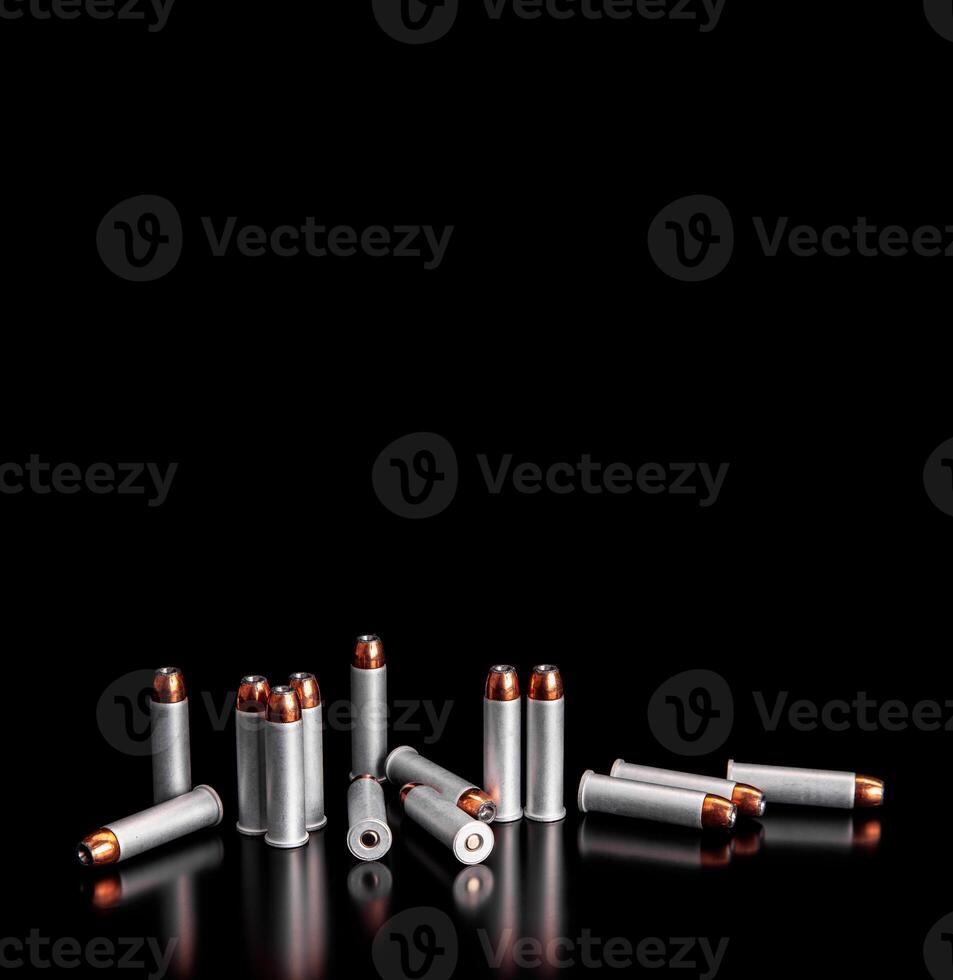 Bullet isolated on black background with reflexion. Rifle bullets close-up on black back. Cartridges for rifle and carbine on a black. photo
