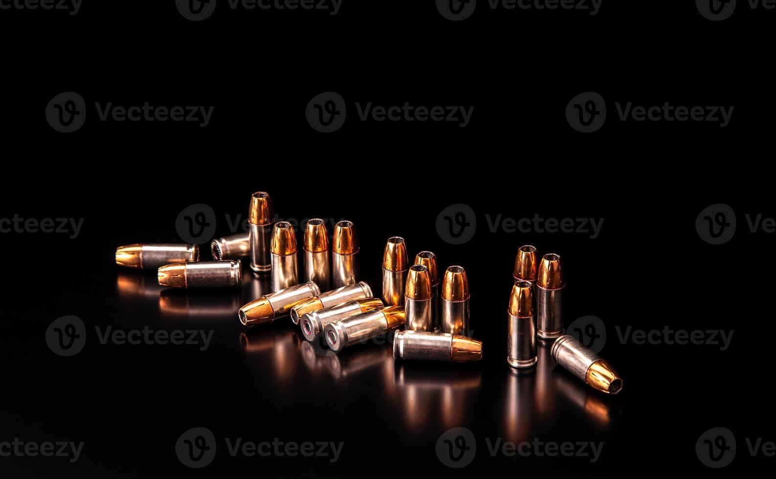 Bullet isolated on black background with reflexion. Rifle bullets close-up on black back. Cartridges for rifle and carbine on a black. photo