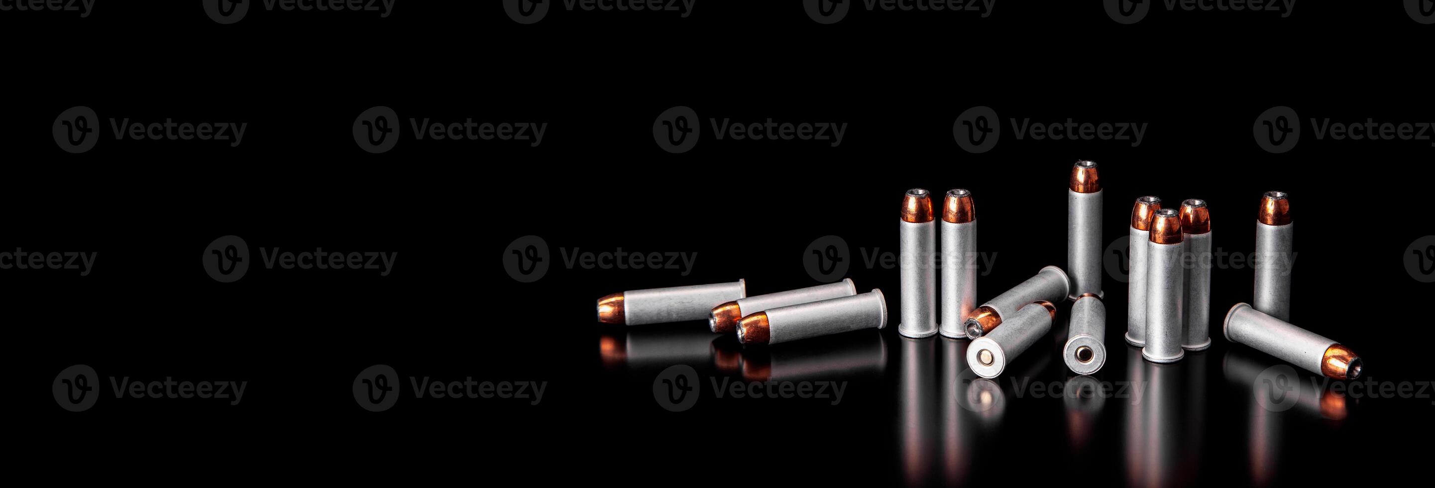 Bullet isolated on black background with reflexion. Rifle bullets close-up on black back. Cartridges for rifle and carbine on a black. photo