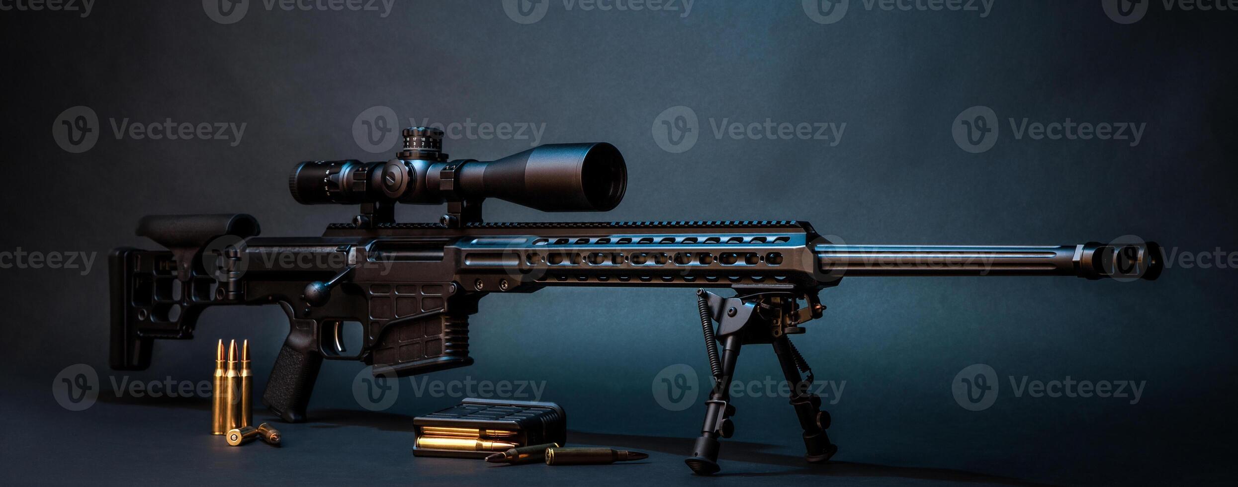 Modern powerful sniper rifle with a telescopic sight mounted on a bipod. Ammo and an additional magazine next to the rifle. photo