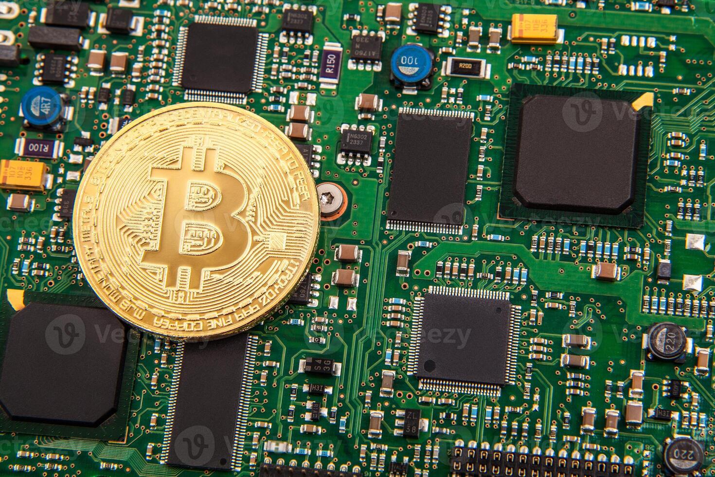 gold coin bitcoin on a green board with microchips photo