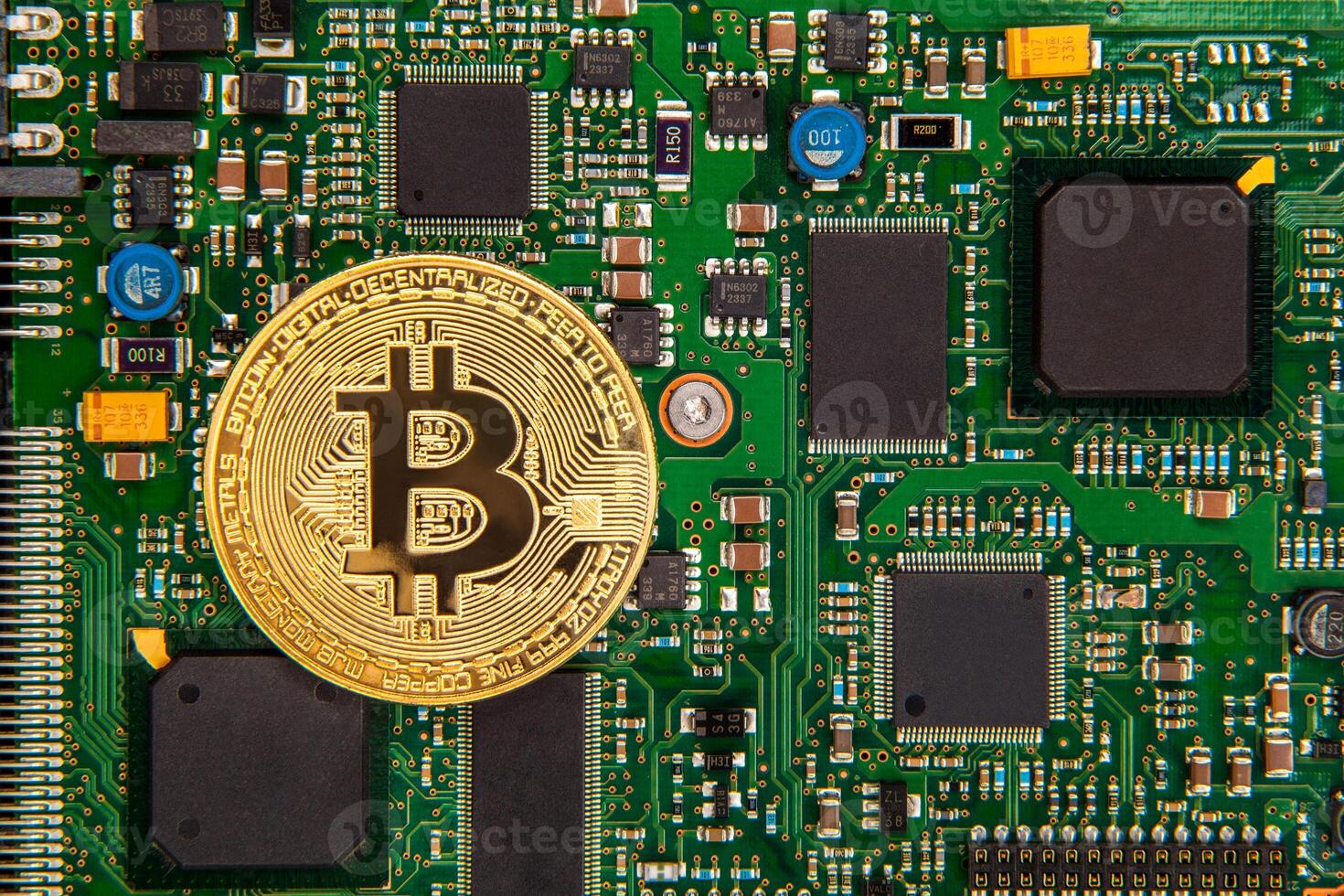 gold coin bitcoin on a green board with microchips photo