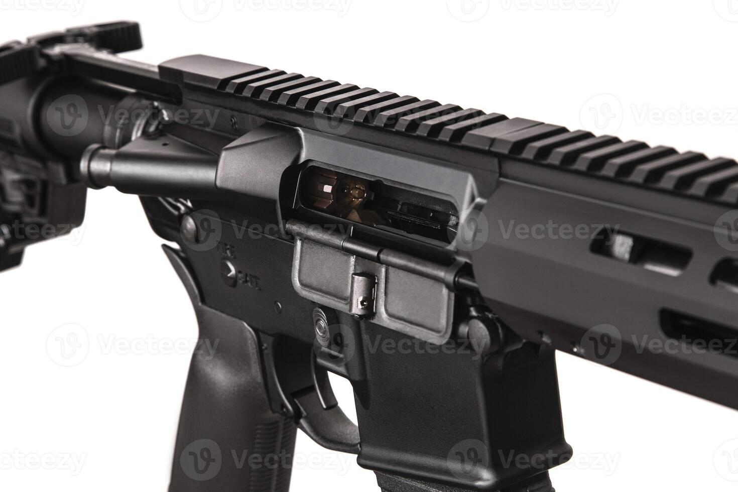 Modern automatic rifle isolated on black background. Weapons for police, special forces and the army. A carbine with optical, mechanical sights and a silencer on a dark back photo