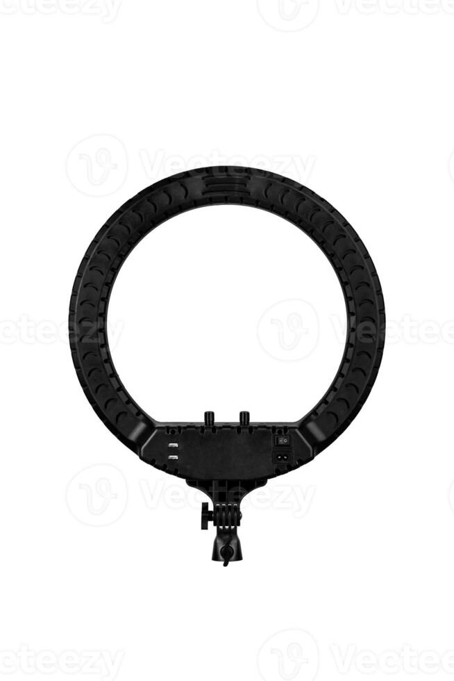 Closeup of circular neon LED lamp isolated white background. Popular modern light for make-up and beauty portraits. photo