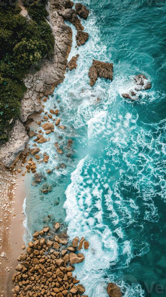 Aerial View of Beach With Rocks and Water photo