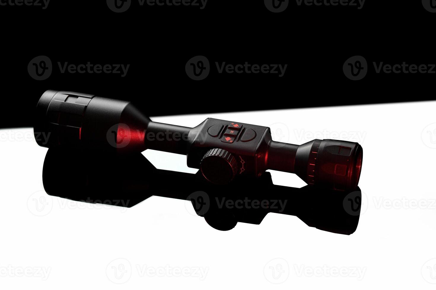 Modern telescopic sight on a smooth mirrored surface. The sight is highlighted in red. A device for shooting at long distances. photo