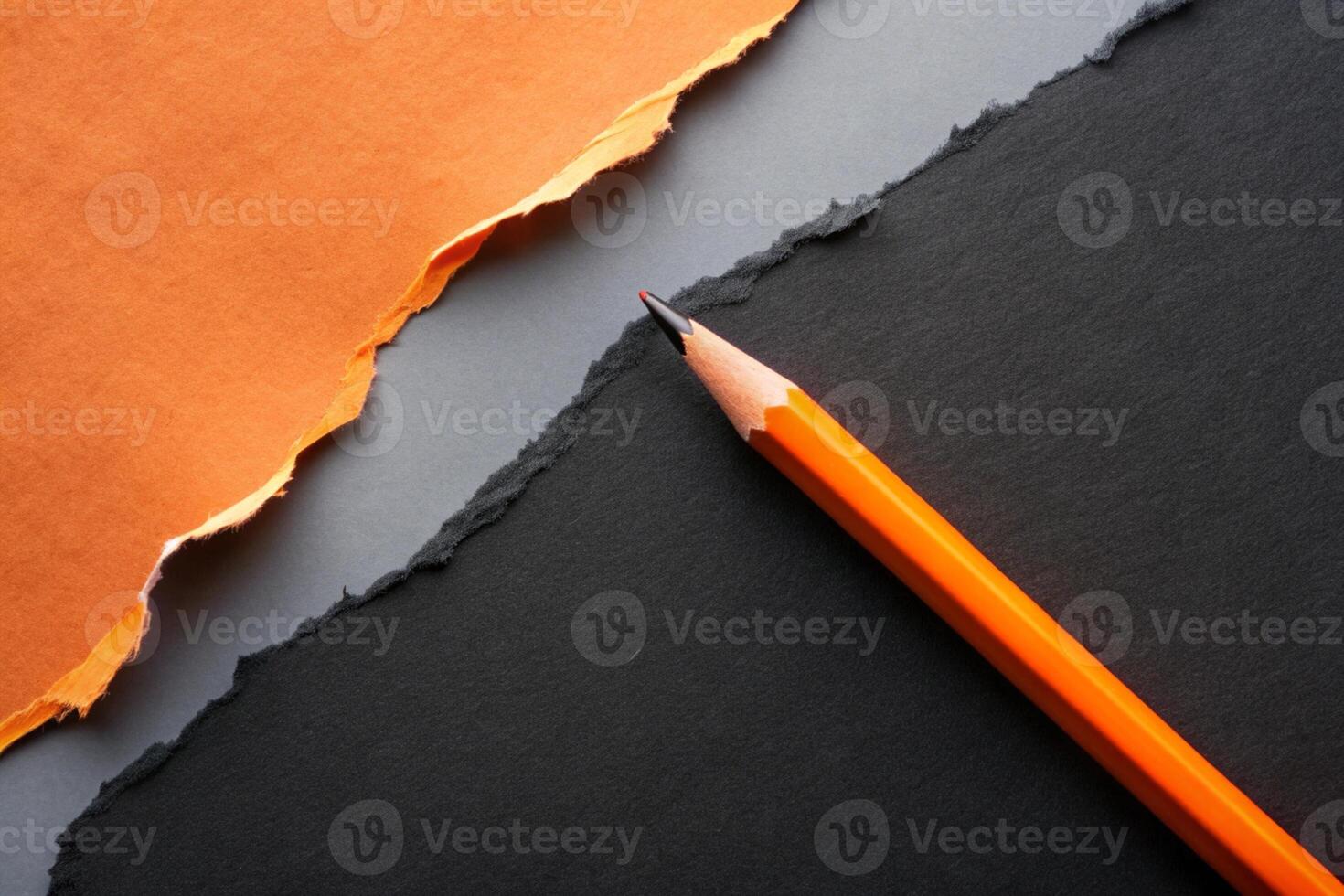 Orange paper torn ripped with pencil on black background for your presentation background photo