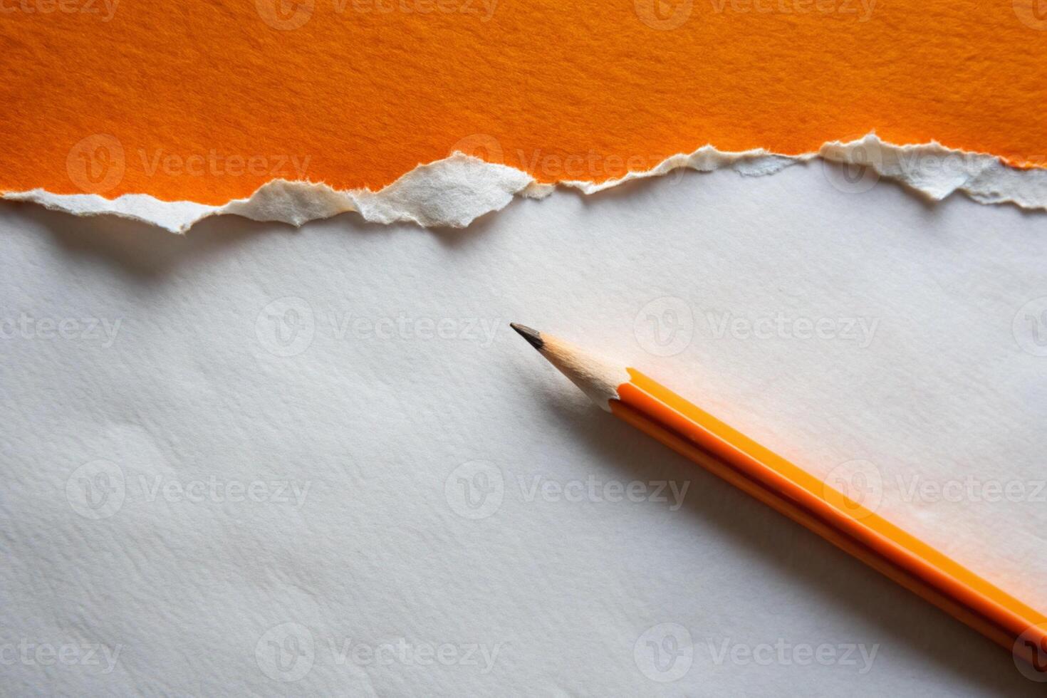 Orange paper torn ripped with pencil on black background for your presentation background photo