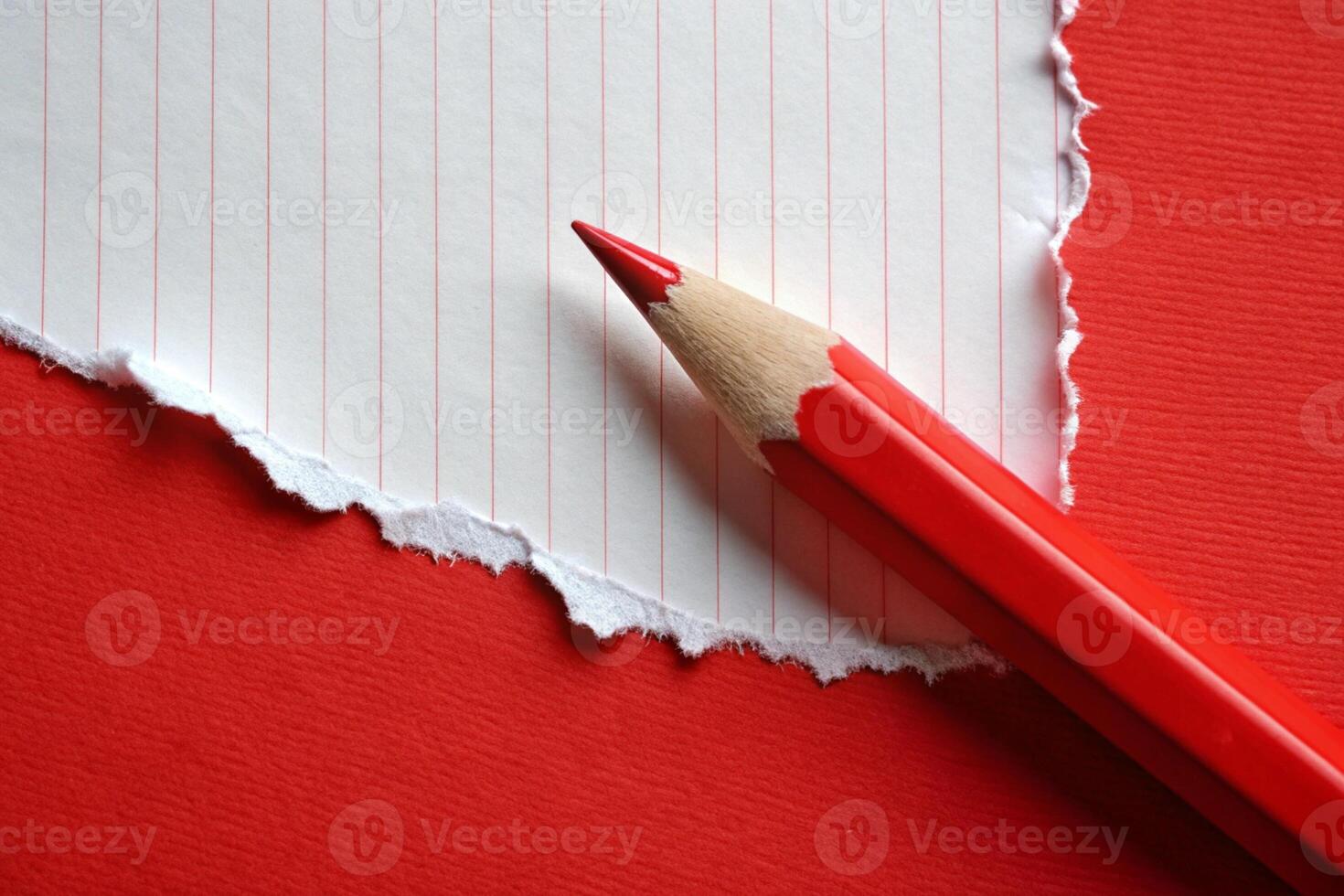White paper torn ripped with pencil on red background for your presentation background photo