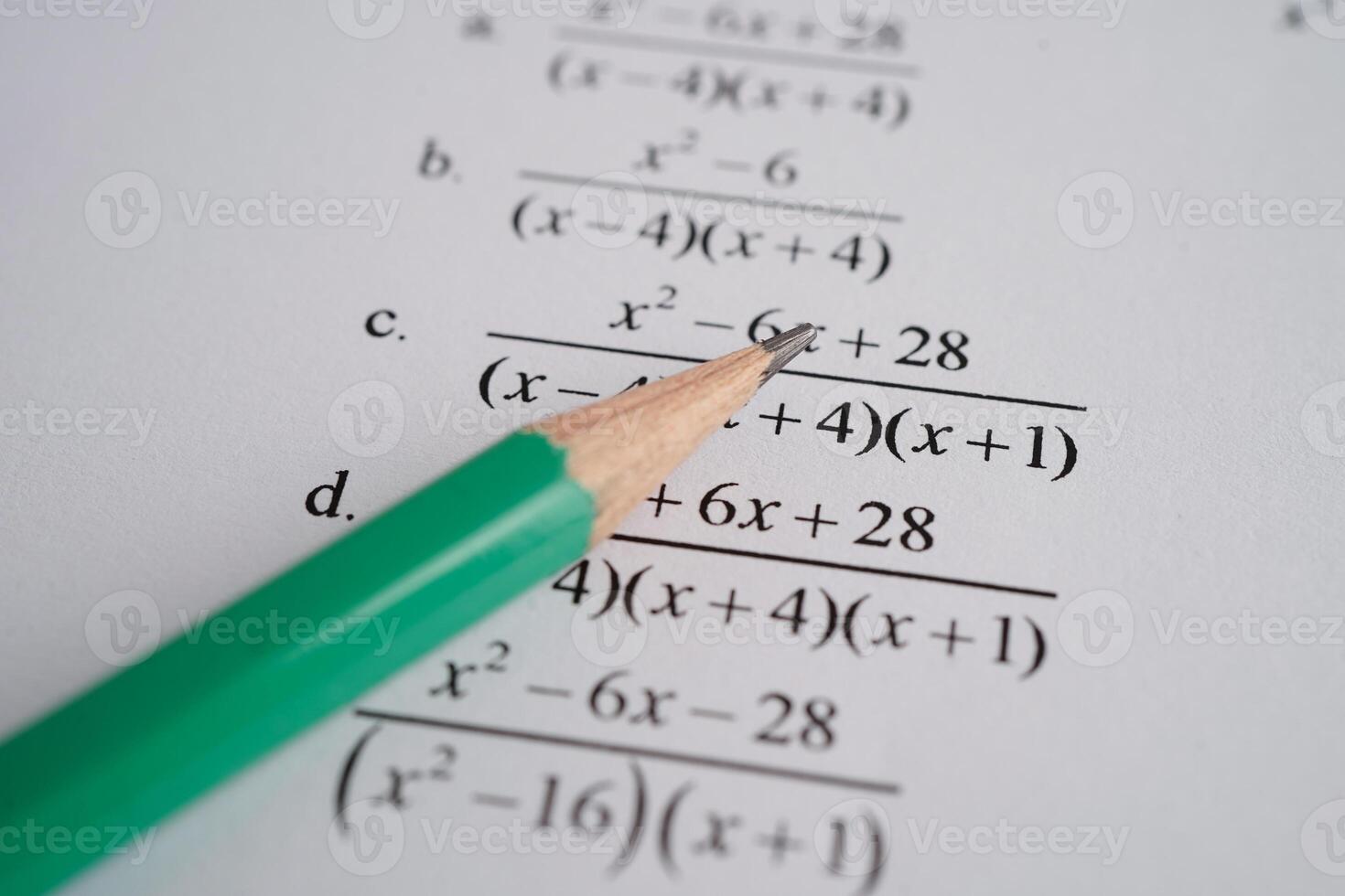 Pencil on mathematic formula exercise test paper in education school. photo